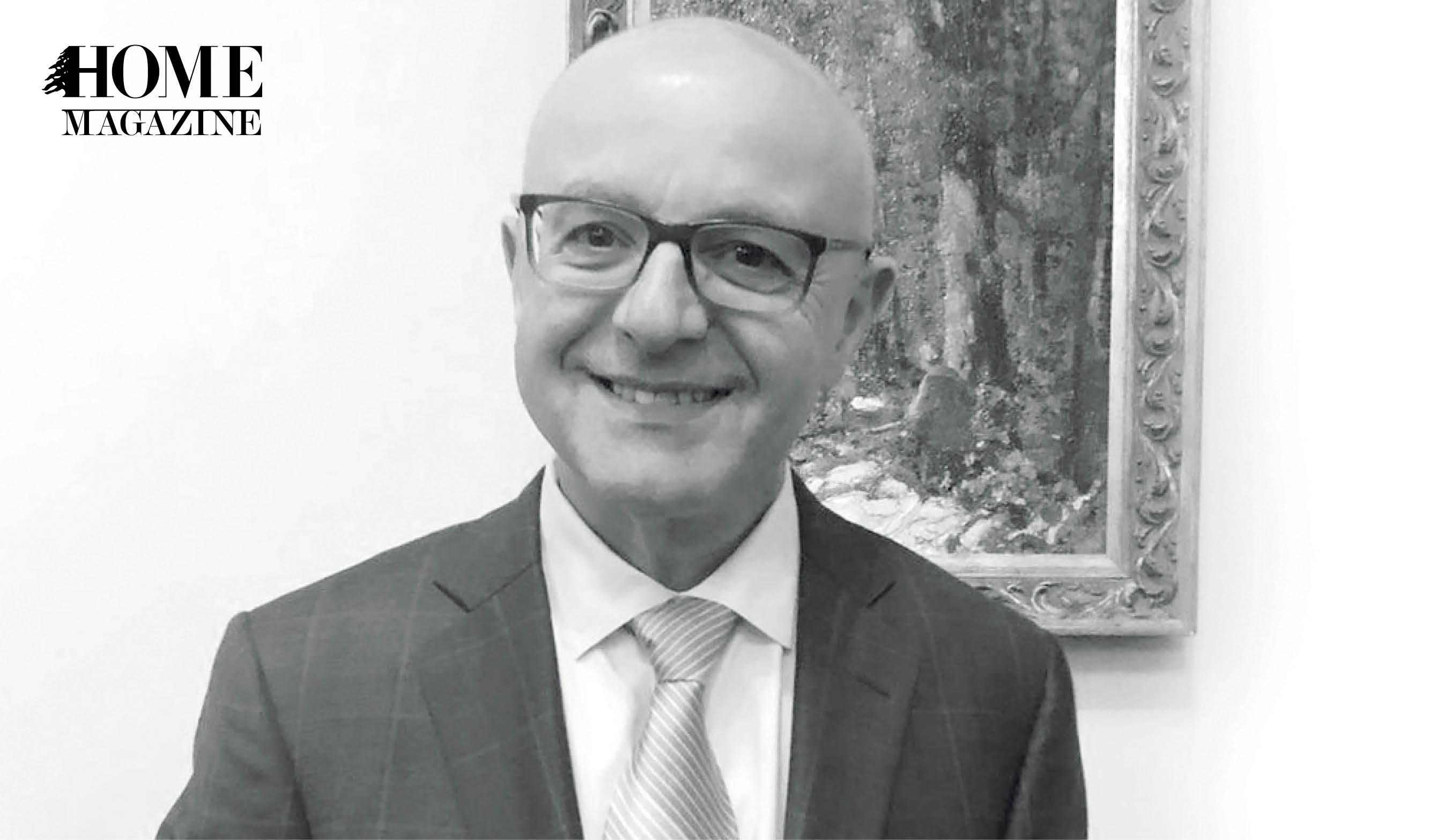 Bald man in suit and eyeglasses